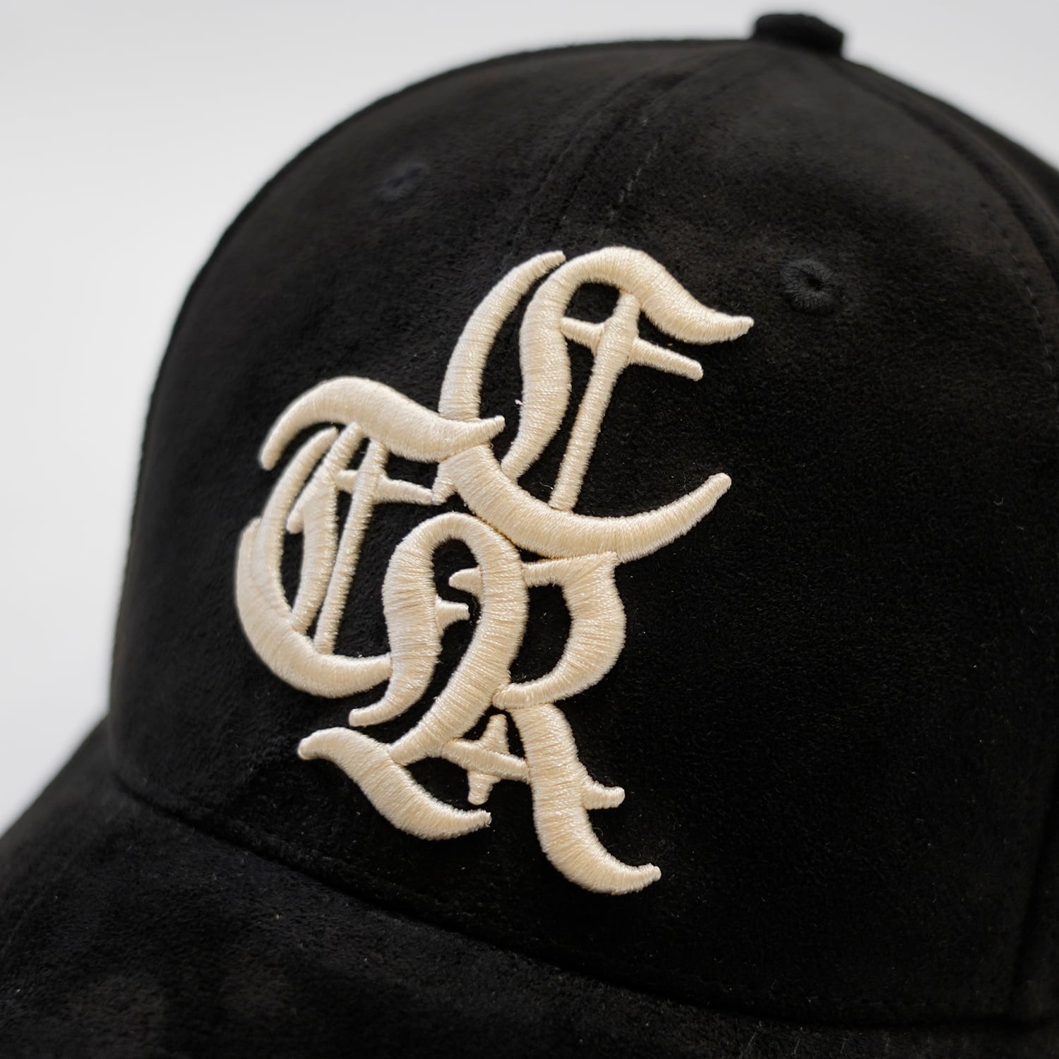 T.C.R LOGO FAUX SUEDE STRAP BACK CAP - BLACK